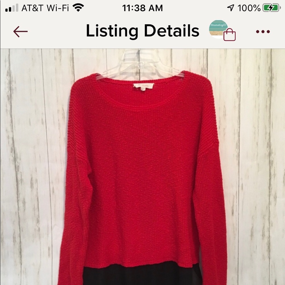 Two by two VC Red sweater layered over black shirt